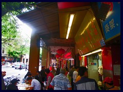 Guangzhou Qiyi Lu (Guangzhou Qiyi Road) is a narrow, winding, road with small stores, markets, shoe stands and buildings in typical Chinese style.
It is very crowded and a bit chaotic, but it is worth to visit since it gives a taste of "the real China". .